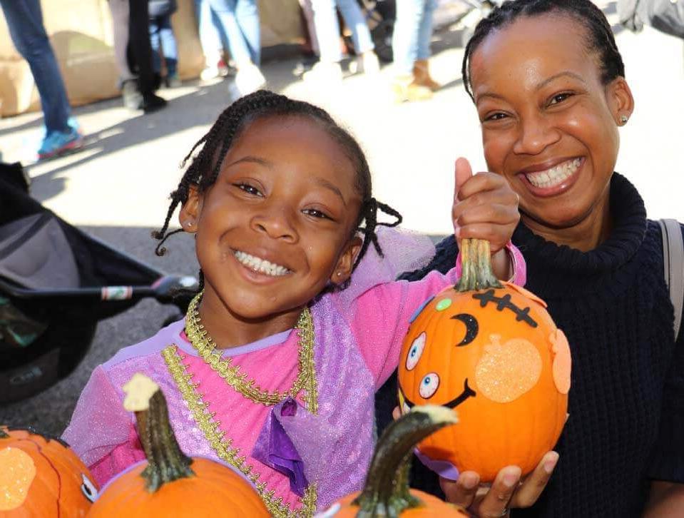 Pumpkin Patch smiling child and parent